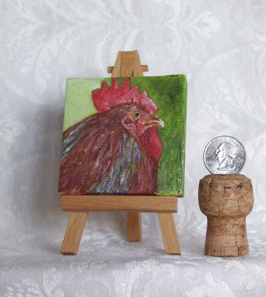 Red Rooster miniature acrylic painting on easel by arstist DJ Geribo